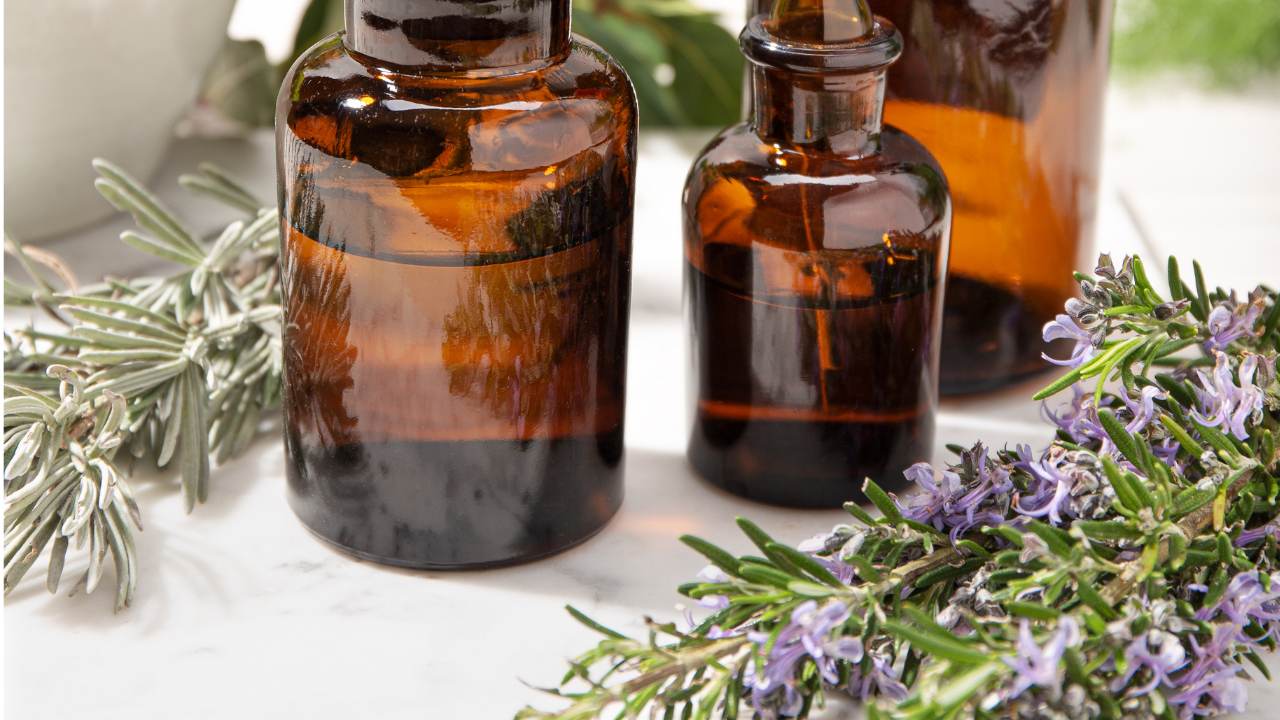 spell oils, essential oils, witchy items, altar, candles, moon girl tarot